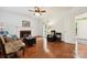 Cozy living room with fireplace, hardwood floors, and neutral decor at 8217 Lansford Rd, Charlotte, NC 28277