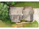Birds-eye view of the home, highlighting the roof, deck and landscape at 8622 Lower Rocky River Rd, Concord, NC 28025