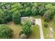 An aerial shot reveals the house with lush trees, large front yard and driveway at 8622 Lower Rocky River Rd, Concord, NC 28025