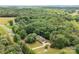 Overhead shot of the home surrounded by lush greenery and a sprawling landscape at 8622 Lower Rocky River Rd, Concord, NC 28025