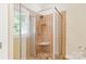 Bathroom shower with glass door, tile surround and floor and white trim at 8622 Lower Rocky River Rd, Concord, NC 28025
