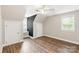 Bedroom with wood floors, two closets, and a window seat at 8622 Lower Rocky River Rd, Concord, NC 28025