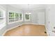 Light-filled dining area with tile flooring, large windows, and a chandelier at 8622 Lower Rocky River Rd, Concord, NC 28025