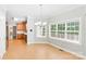 Inviting dining area featuring tile floors, large window views and a hanging chandelier at 8622 Lower Rocky River Rd, Concord, NC 28025