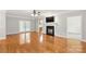 Beautifully decorated living room with hardwood floors, a fireplace and French doors at 8622 Lower Rocky River Rd, Concord, NC 28025