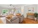 Spacious living room with hardwood flooring, neutral color scheme and staircase leading to upper level at 8622 Lower Rocky River Rd, Concord, NC 28025