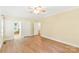 Spacious primary bedroom with wood-look flooring and access to the bathroom at 8622 Lower Rocky River Rd, Concord, NC 28025