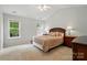 Bright, spacious bedroom with vaulted ceiling, ceiling fan, and ample natural light at 9856 Caldwell Depot Rd, Cornelius, NC 28031