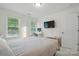Bright bedroom with natural light, workspace, and a neutral decor at 9856 Caldwell Depot Rd, Cornelius, NC 28031