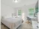 Bright bedroom with natural light, workspace, and neutral décor at 9856 Caldwell Depot Rd, Cornelius, NC 28031