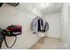Spacious walk-in closet with built-in shelving and ample storage space at 9856 Caldwell Depot Rd, Cornelius, NC 28031