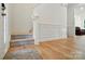Inviting entryway with hardwood floors, staircase, and wainscoting at 9856 Caldwell Depot Rd, Cornelius, NC 28031