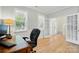 Office space with large windows, desk, and doorway to main entry at 9856 Caldwell Depot Rd, Cornelius, NC 28031