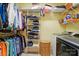 Organized closet with wire shelving and hanging rods, featuring a washer and dryer at 9950 Foil Rd, Mount Pleasant, NC 28124