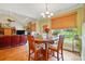 Bright dining area with natural light, hardwood floors, and seating for four people at 9950 Foil Rd, Mount Pleasant, NC 28124