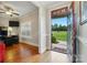 Inviting foyer featuring hardwood floors, and a view of the front yard, leading into a well-lit office space at 9950 Foil Rd, Mount Pleasant, NC 28124