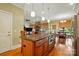 Spacious kitchen with large island, granite countertops, and stainless steel appliances at 9950 Foil Rd, Mount Pleasant, NC 28124