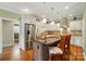 Beautiful kitchen with white cabinetry, stainless steel appliances, and a large island with pendant lighting at 9950 Foil Rd, Mount Pleasant, NC 28124