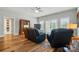 Bright living room with hardwood floors, ceiling fan, leather recliners and french doors at 9950 Foil Rd, Mount Pleasant, NC 28124