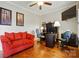 Comfortable home office with hardwood floors, a red couch, and ample workspace for productivity at 9950 Foil Rd, Mount Pleasant, NC 28124
