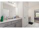 Bathroom showcasing modern gray cabinetry and countertops, offering both style and functionality at 10045 Carousel Corral Dr, Midland, NC 28107