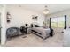 This bedroom features plush carpet, neutral tones, an accent chair and modern furnishings at 10045 Carousel Corral Dr, Midland, NC 28107
