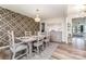 An elegant dining room features stylish decor and a chandelier over a table set for six at 10045 Carousel Corral Dr, Midland, NC 28107