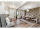 Elegant dining area featuring a stylish light fixture and eye-catching accent wall at 10045 Carousel Corral Dr, Midland, NC 28107