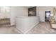 Upstairs hallway features plush carpeting, white walls, and decorative accents at 10045 Carousel Corral Dr, Midland, NC 28107