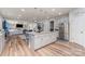 Open-concept kitchen featuring a large island, stainless steel appliances, and a view into the living area at 10045 Carousel Corral Dr, Midland, NC 28107