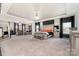 This is an expansive primary bedroom suite with sitting area, neutral tones, and lots of natural light at 10045 Carousel Corral Dr, Midland, NC 28107