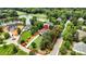 An aerial view of an estate home showing the surrounding property, nearby lake, and green landscape at 106 Kent Ct, Mooresville, NC 28117