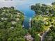 Stunning aerial view of a lake community with lush greenery and docks, offering a serene waterfront lifestyle at 106 Kent Ct, Mooresville, NC 28117