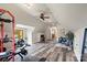 Expansive bonus room with workout equipment, a desk area, and French doors leading to a balcony at 106 Kent Ct, Mooresville, NC 28117