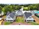 Aerial shot of a well-maintained community clubhouse with pristine landscaping and access to golf course and pool at 106 Kent Ct, Mooresville, NC 28117