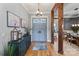 Stylish foyer with hardwood floors, decor and bright natural light at 106 Kent Ct, Mooresville, NC 28117