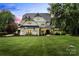 Stunning two-story home with black trim, white siding and lush green lawn at 106 Kent Ct, Mooresville, NC 28117