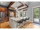 Bright kitchen showcases a center island with bar seating and stainless steel appliances at 106 Kent Ct, Mooresville, NC 28117