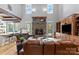 Bright and inviting living room with stone fireplace and built in shelves at 106 Kent Ct, Mooresville, NC 28117