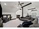 Inviting living room featuring vaulted ceilings, dark beams, modern furniture, and stylish décor at 106 Kent Ct, Mooresville, NC 28117