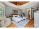 Comfortable main bedroom featuring hardwood floors, neutral decor, and ensuite bathroom at 106 Kent Ct, Mooresville, NC 28117