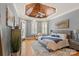 Serene main bedroom with tray ceiling, hardwood floors, and ample natural light at 106 Kent Ct, Mooresville, NC 28117
