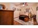 Bedroom with natural light and hardwood floors complemented by a decorative rug and vintage trunk at 111 Gordon Ave, Shelby, NC 28152