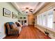 Bright and inviting living room with wood floors, a coffered ceiling, and plenty of natural light at 111 Gordon Ave, Shelby, NC 28152
