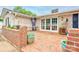 Brick patio area features brick walls, an umbrella, and views of the in-ground pool and landscaped yard at 111 Gordon Ave, Shelby, NC 28152