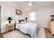 Bright bedroom with ceiling fan, neutral decor, and matching bedside lamps at 1152 Penrose Ln, Charlotte, NC 28217