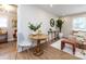 Bright dining area adjacent to the living room, featuring a round table and comfortable seating at 1152 Penrose Ln, Charlotte, NC 28217