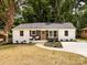 Charming renovated home with a newly landscaped front yard and fresh exterior paint at 1152 Penrose Ln, Charlotte, NC 28217