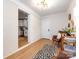 Hallway view toward kitchen, decorated with modern light fixture and white brick wall at 1152 Penrose Ln, Charlotte, NC 28217