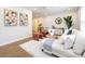 Sunlit living room with modern decor, a comfortable sofa, and unique geometric wall art at 1152 Penrose Ln, Charlotte, NC 28217